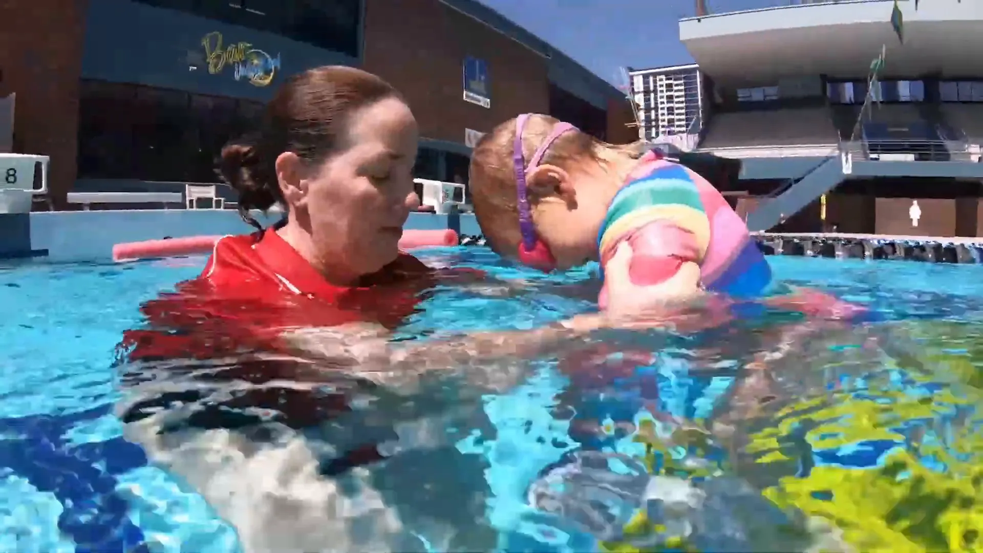 child jumping into the water